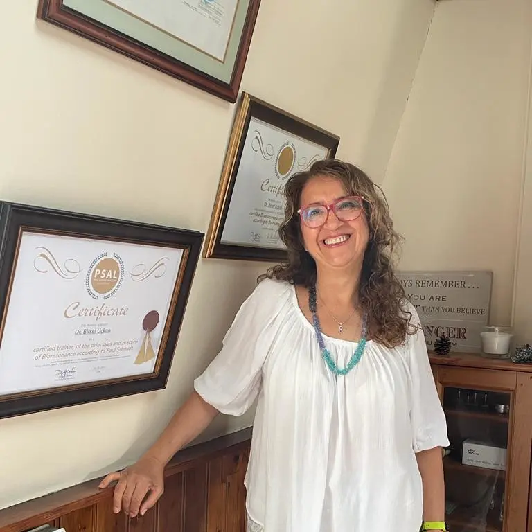 Portrait of Dr. I. Birsel Uçkun at her integrative medicine clinic in London